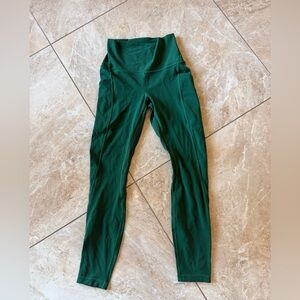 Lululemon leggings, 23” size 4, green, with pockets.